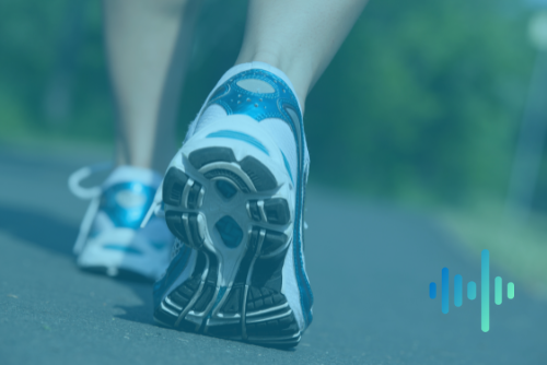 Close-up of a runner's trainers striding along a path in a blue-green tint, with a waveform