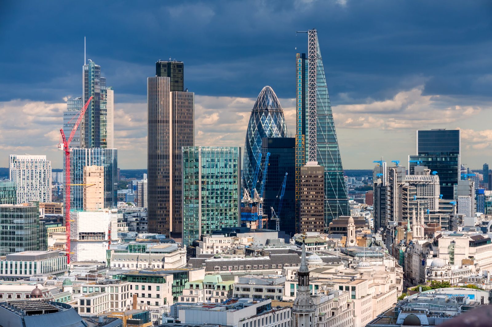 City of London skyscrapers, including the Gherkin and the Leadenhall Building, under a cloudy sky
