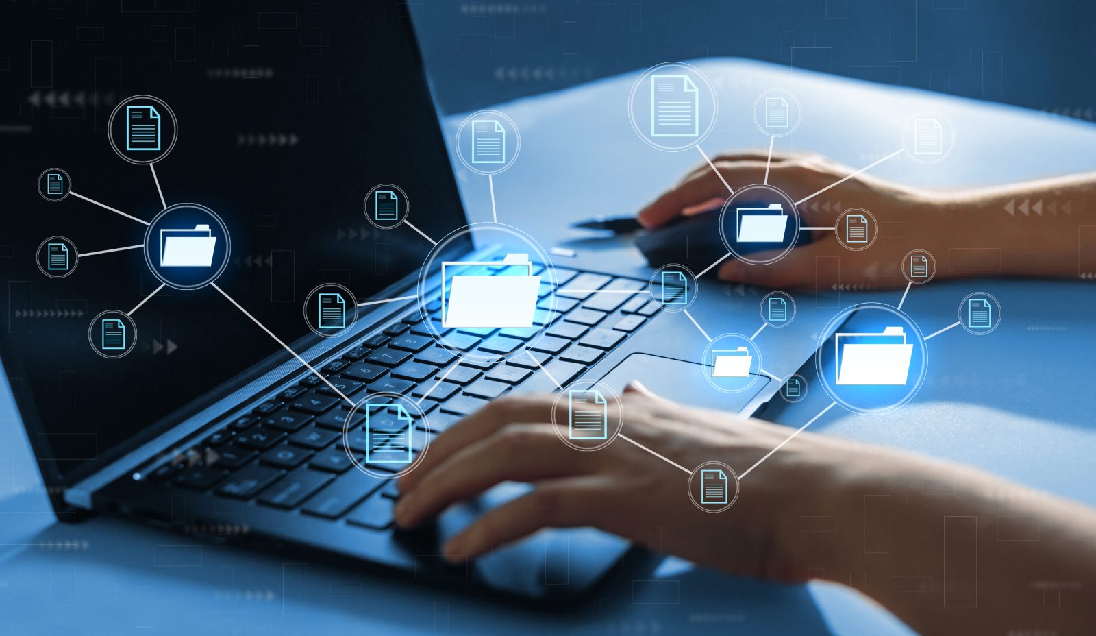 Hands typing on a laptop overlaid with a glowing network of linked folder and document icons