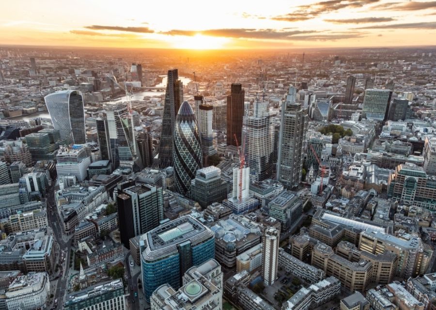 Aerial London sunset financial district city skyscrapers UK