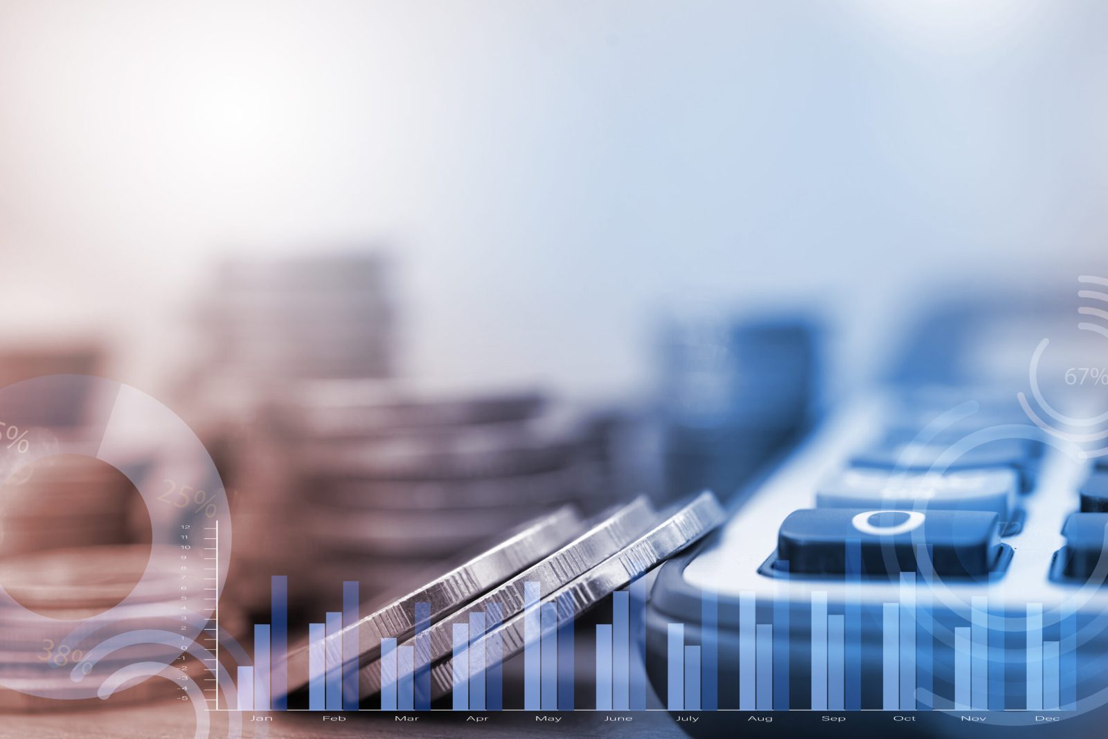 Stacked coins and a calculator with a faint bar chart overlay in soft blue and white light