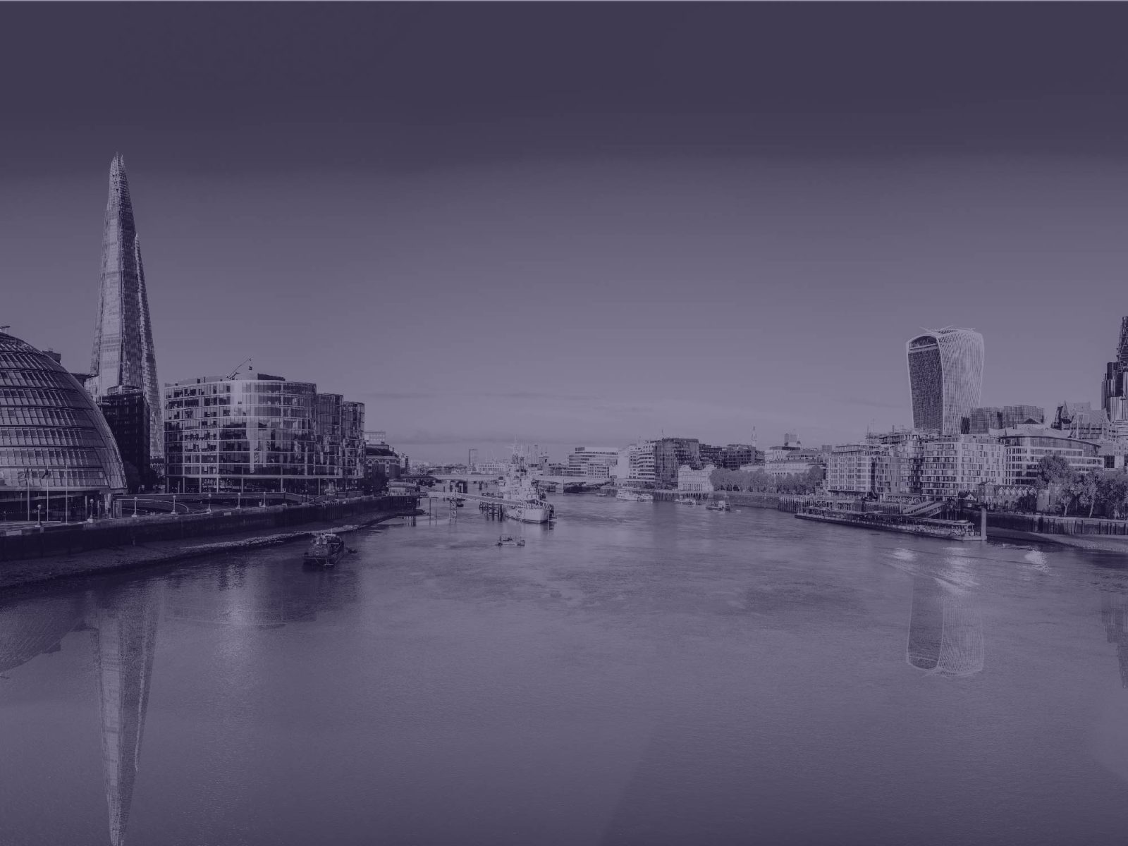 The River Thames and London skyline, including the Shard and City Hall, under a muted purple tint