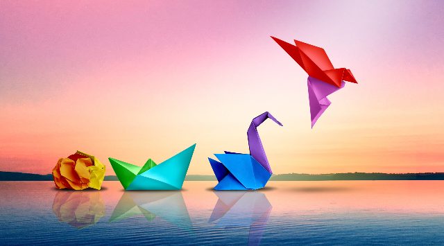 Evolving For Success and a metaphor as Transform or changing to succeed concept and leadership in business through innovation and evolution of ability as a crumpled paper transforming.
